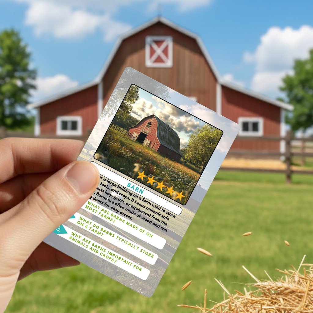 Card with a barn illustration held in front of a red barn on a farm.