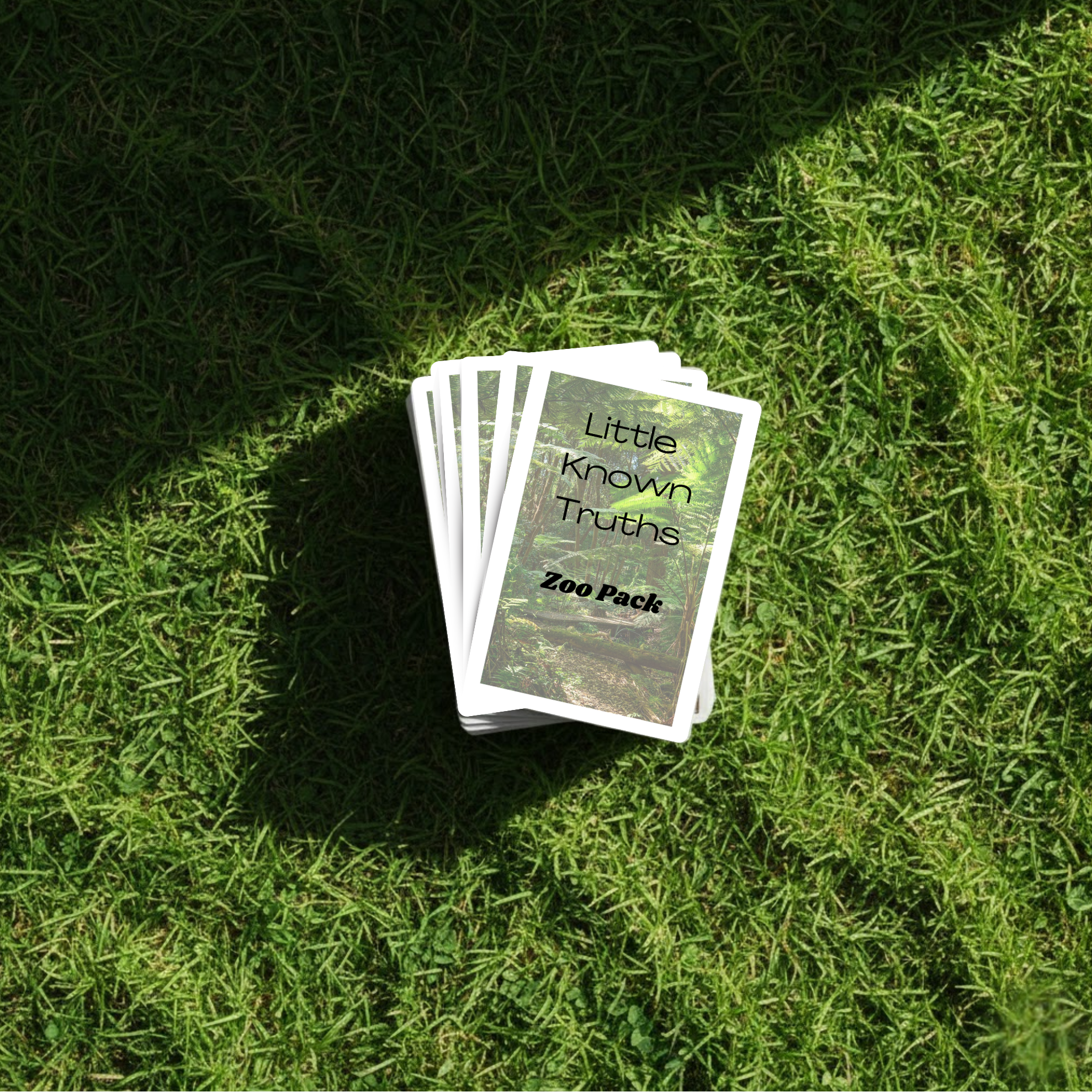 Card pack titled 'Little Known Truths Zoo Pack' on grass